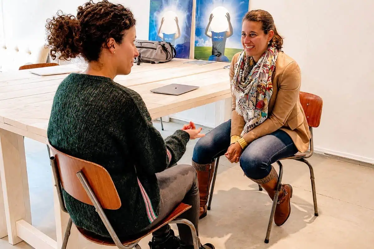 Two students in conversation during an NLP practice session in Amsterdam