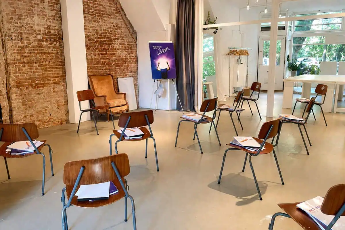 Amsterdam training studio with exposed brick and seating, used for Global NLP Training courses